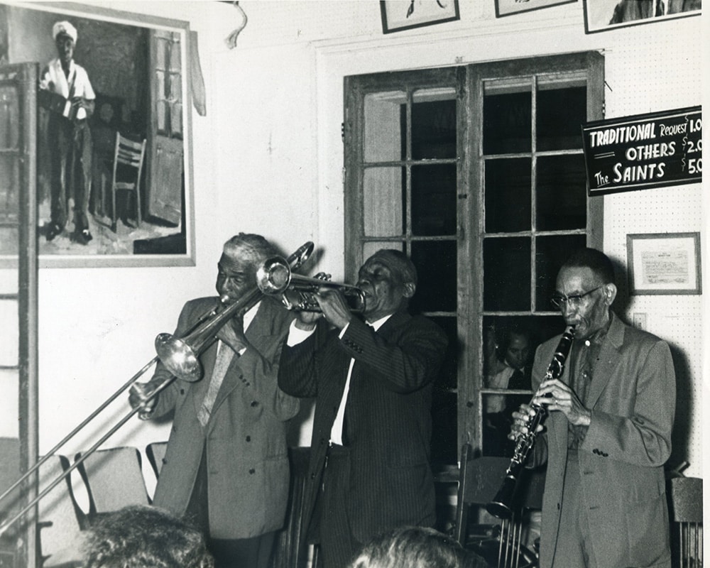 Louis Nelson, Punch Miller, and George Lewis playing on the Hall's bandstand (1964).